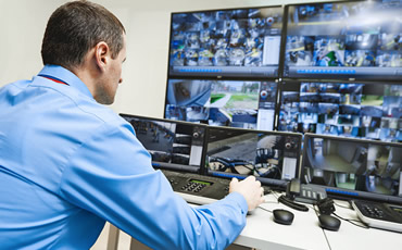 man monitoring on screen